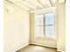 Spacious bedroom with large window and exposed beams at 32 Peachtree Nw St # 1006, Atlanta, GA 30303