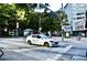 Street view of a city block with cars and pedestrians at 32 Peachtree Nw St # 1006, Atlanta, GA 30303