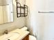 Clean bathroom with a vanity, toilet, and shower/tub combo at 32 Peachtree Nw St # 1006, Atlanta, GA 30303
