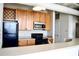 Modern kitchen features wood cabinets, stainless steel appliances, and a breakfast bar at 32 Peachtree Nw St # 1006, Atlanta, GA 30303