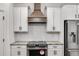 Stainless steel kitchen stove with modern range hood at 180 Harmony Ridge Dr, Temple, GA 30179