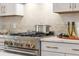 Modern kitchen with stainless steel range and quartz countertops at 201 New St # 2201-9, Decatur, GA 30030