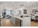 Open concept kitchen with island and views into living area at 201 New St # 2201-9, Decatur, GA 30030