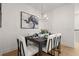 Elegant dining room features a dark wood table and white chairs, perfect for dinner parties at 201 New St # 2201-9, Decatur, GA 30030