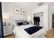 Bright bedroom with a white bed, walk-in closet, and modern decor at 201 New St # 2201-9, Decatur, GA 30030