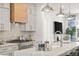 Modern kitchen boasts stainless steel appliances and a light-colored island at 201 New St # 2201-9, Decatur, GA 30030