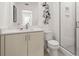 Clean bathroom with walk-in shower and light wood vanity at 201 New St # 2201-9, Decatur, GA 30030