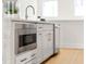 Modern kitchen with built in microwave and quartz countertops at 201 New St # 2201-9, Decatur, GA 30030