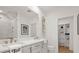 Modern bathroom with dual sinks, walk-in shower, and closet at 201 New St # 2201-9, Decatur, GA 30030