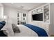 Spacious bedroom with built-in shelving and large TV at 201 New St # 2201-9, Decatur, GA 30030