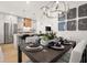 Modern kitchen and dining area with stainless steel appliances and island at 201 New St # 2201-9, Decatur, GA 30030