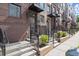 Brick townhouses with front porches and landscaping at 201 New St # 2201-9, Decatur, GA 30030