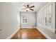 Bright bedroom with hardwood floors and window shutters at 906 Courtenay Ne Dr, Atlanta, GA 30306