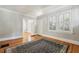 Hardwood floor living room with views into other rooms and front entrance at 906 Courtenay Ne Dr, Atlanta, GA 30306