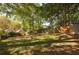 Sunny backyard with shed and wooded backdrop at 906 Courtenay Ne Dr, Atlanta, GA 30306