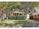 Cute bungalow with lush lawn and mature trees at 906 Courtenay Ne Dr, Atlanta, GA 30306