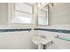 Bathroom with pedestal sink and subway tile at 906 Courtenay Ne Dr, Atlanta, GA 30306
