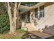 Charming brick ranch home with covered porch and established landscaping at 906 Courtenay Ne Dr, Atlanta, GA 30306