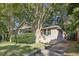 Brick house with a well-manicured lawn and driveway at 906 Courtenay Ne Dr, Atlanta, GA 30306