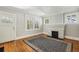 Living room with hardwood floors, fireplace, and access to front entrance at 906 Courtenay Ne Dr, Atlanta, GA 30306