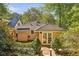 Back exterior view of charming yellow cottage at 906 Courtenay Ne Dr, Atlanta, GA 30306