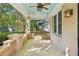 Inviting front porch with a swing and brick exterior at 906 Courtenay Ne Dr, Atlanta, GA 30306
