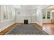 Bright living room with hardwood floors, fireplace, and large windows at 906 Courtenay Ne Dr, Atlanta, GA 30306