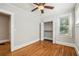 Hardwood floor bedroom with ceiling fan and built-in closet at 906 Courtenay Ne Dr, Atlanta, GA 30306