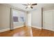 Bright bedroom with hardwood floors, ceiling fan and large windows at 906 Courtenay Ne Dr, Atlanta, GA 30306