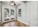 Sunroom with French doors leading to the backyard and terracotta tile floors at 906 Courtenay Ne Dr, Atlanta, GA 30306