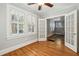 Hardwood floor bedroom with French doors and window shutters at 906 Courtenay Ne Dr, Atlanta, GA 30306