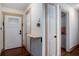 Bright entryway with hardwood floors, coat rack, and access to bedrooms at 93 Floyd Ln, Hampton, GA 30228