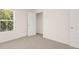 Well-lit bedroom with closet and window view at 536 Whitman (2010) Ln, Stockbridge, GA 30281