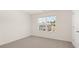 Simple bedroom with carpeted floor and a window view at 536 Whitman (2010) Ln, Stockbridge, GA 30281