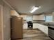 Renovated kitchen with white cabinets and granite counters at 1904 Sandtown Sw Rd, Atlanta, GA 30311