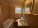 Clean bathroom with tub and updated vanity at 1904 Sandtown Sw Rd, Atlanta, GA 30311