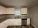 Galley kitchen with white cabinets and granite countertops at 1904 Sandtown Sw Rd, Atlanta, GA 30311