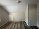 Well-lit bedroom, sloped ceilings, and spacious closet at 1904 Sandtown Sw Rd, Atlanta, GA 30311