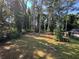 Spacious backyard with mature trees and grassy area at 1904 Sandtown Sw Rd, Atlanta, GA 30311