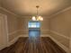 Bright dining room with hardwood floors and chandelier at 1904 Sandtown Sw Rd, Atlanta, GA 30311