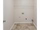 Laundry room with tile floor and shelving at 4011 Lafayette Way, Loganville, GA 30052