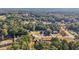 Aerial view of a neighborhood with various houses and trees at 4011 Lafayette Way, Loganville, GA 30052