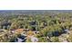 Aerial view of homes nestled in a wooded neighborhood at 4011 Lafayette Way, Loganville, GA 30052