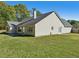 House with large backyard, patio, and grassy area at 4011 Lafayette Way, Loganville, GA 30052