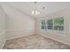 Dining area with tile flooring and a view to the kitchen at 4011 Lafayette Way, Loganville, GA 30052