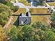 Aerial view of a house with a large backyard and surrounding trees at 4011 Lafayette Way, Loganville, GA 30052