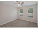 Bedroom with two windows and ceiling fan at 4011 Lafayette Way, Loganville, GA 30052