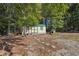 Spacious backyard with shed and lawn mower at 4011 Lafayette Way, Loganville, GA 30052