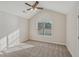 Bedroom featuring an arched window and ceiling fan at 4011 Lafayette Way, Loganville, GA 30052