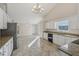 Kitchen boasts granite countertops and white cabinets at 4011 Lafayette Way, Loganville, GA 30052